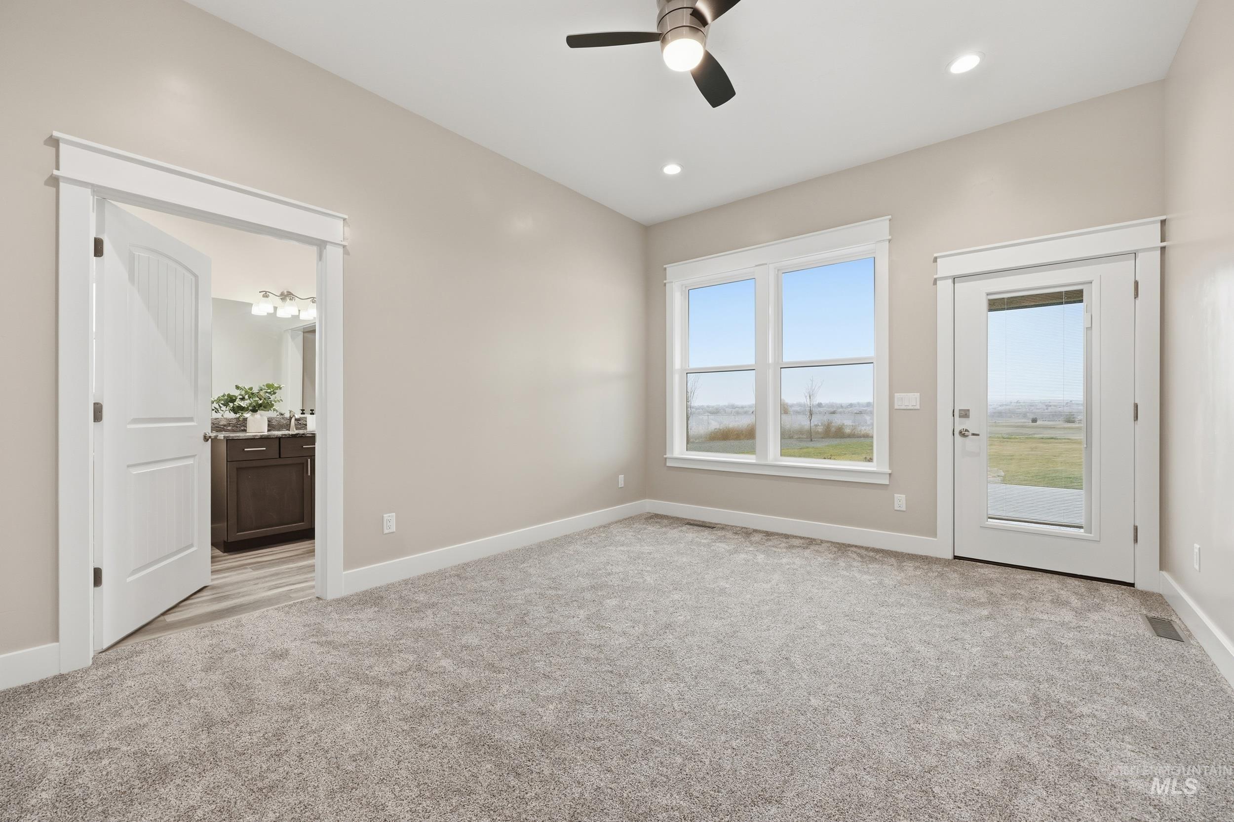 9264 Basin Kid Court Middleton, ID 83644 - Photo 29 of 50 Unfurnished room featuring light carpet, a ceiling fan, and recessed lighting