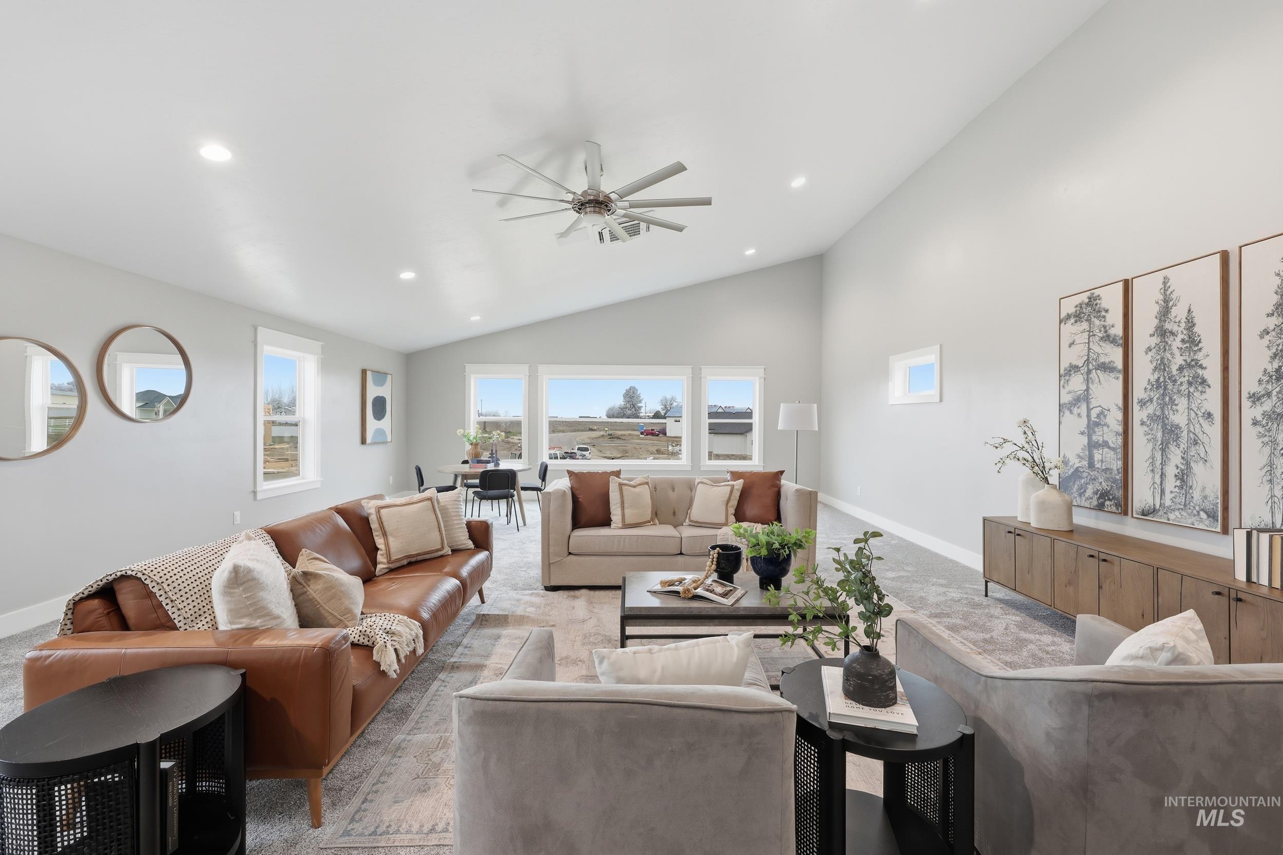 9264 Basin Kid Court Middleton, ID 83644 - Photo 43 of 50 Living room with vaulted ceiling, recessed lighting, and a ceiling fan