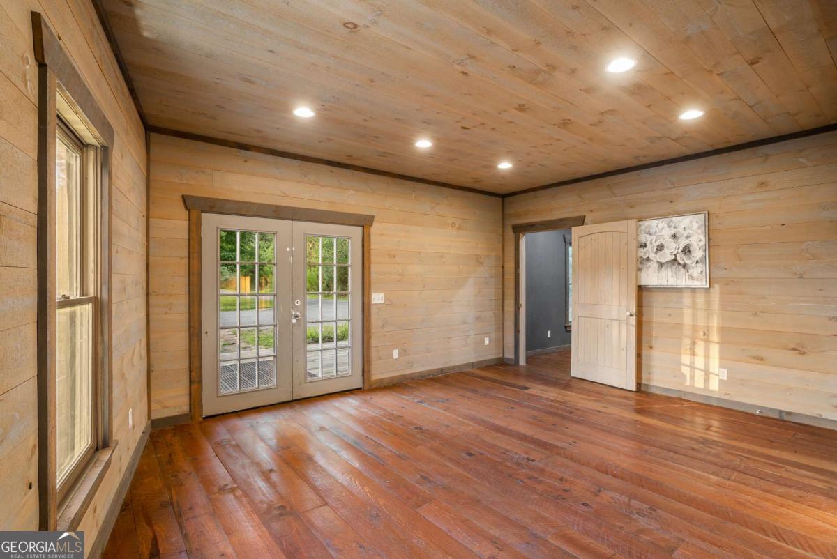 2637 River Road Mineral Bluff, GA 30559 - Photo 12 of 69 a view of an empty room with wooden floor and a window