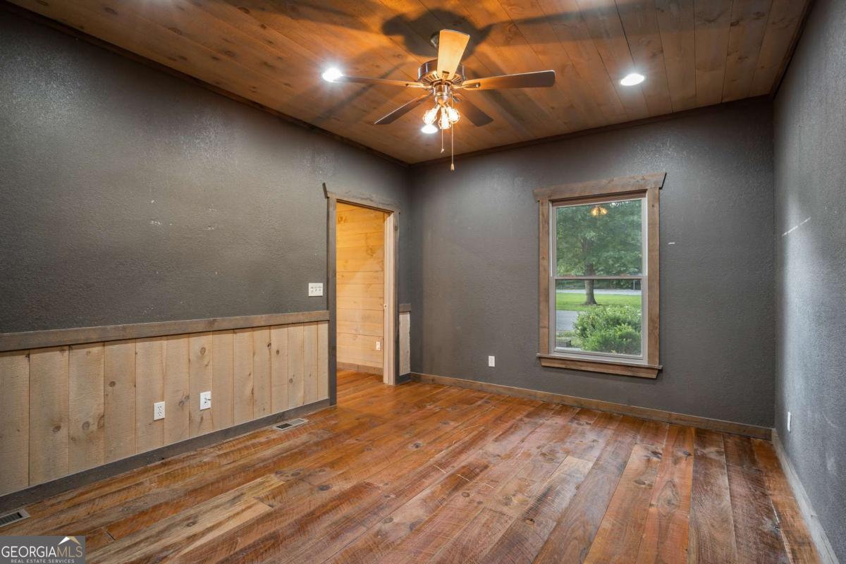 2637 River Road Mineral Bluff, GA 30559 - Photo 15 of 69 wooden floor in an empty room with a window