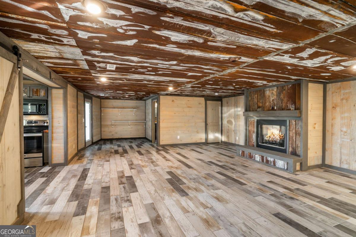 2637 River Road Mineral Bluff, GA 30559 - Photo 23 of 69 a view of a room with wooden floor and a window