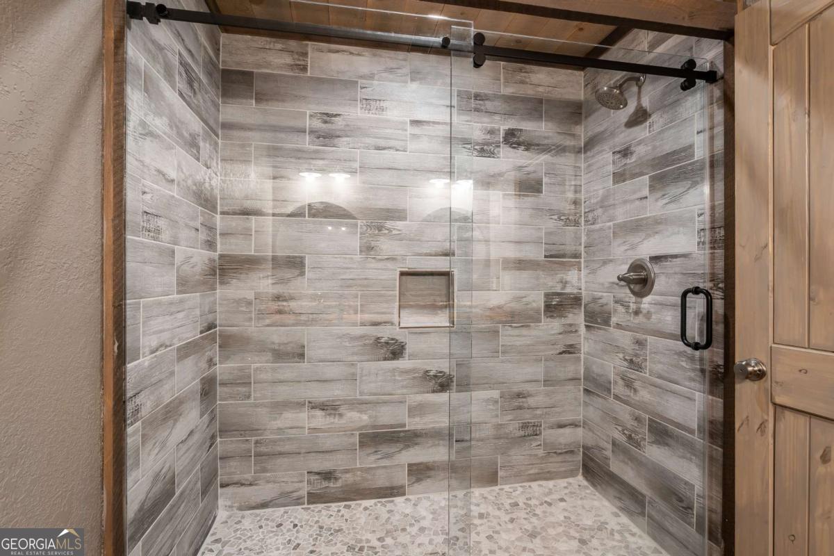 2637 River Road Mineral Bluff, GA 30559 - Photo 43 of 69 a bathroom with a shower
