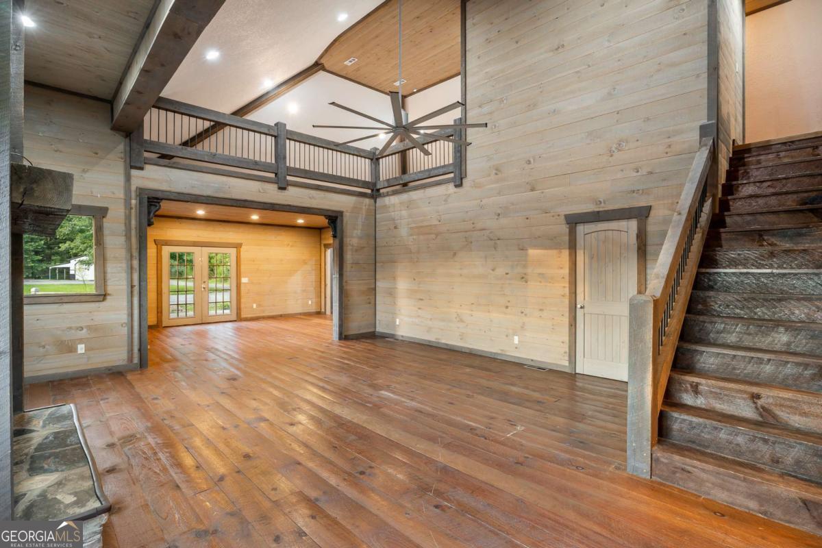 2637 River Road Mineral Bluff, GA 30559 - Photo 7 of 69 a view of an empty room with wooden floor and a window