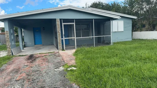a house with yard in front of it