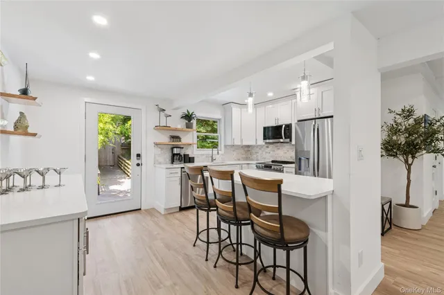 a view of a balcony with chairs