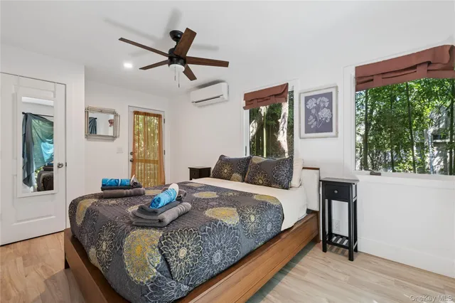 a bedroom with a bed and window