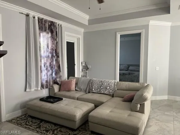 a living room with furniture and a window