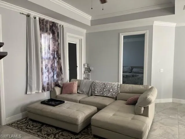 a living room with furniture and a window