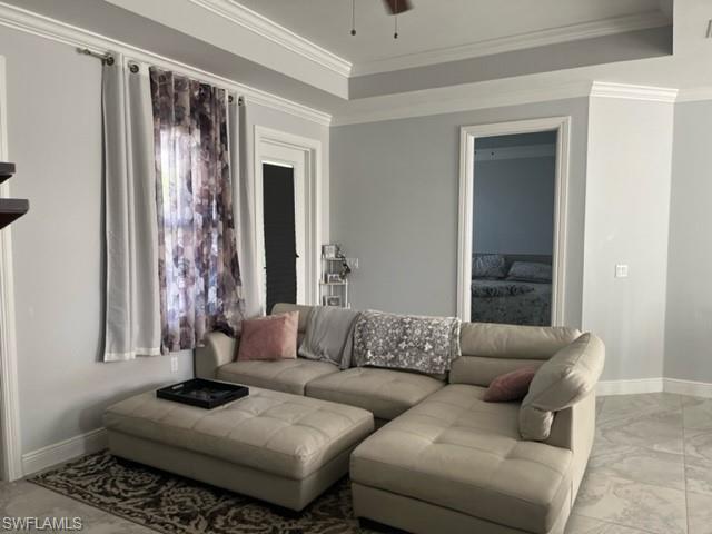 2930 37th Avenue Northeast Naples, FL 34120 - Photo 3 of 8 a living room with furniture and a window