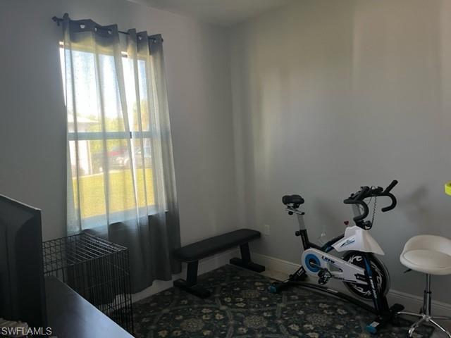 2930 37th Avenue Northeast Naples, FL 34120 - Photo 4 of 8 a living room with furniture and a window