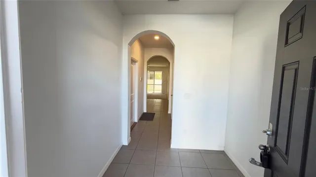 a view of a hallway to a bedroom