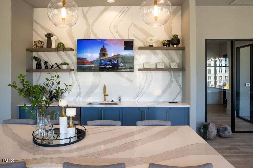 2000 Olivewood Street, Unit A4 Cary, NC 27519 - Photo 18 of 19 a room with a table and chairs