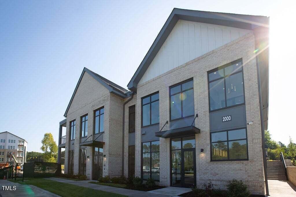 2000 Olivewood Street, Unit A4 Cary, NC 27519 - Photo 7 of 19 a view of a brick house with many windows