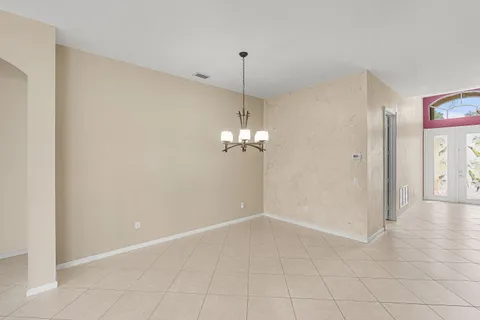 a spacious bathroom with a tub sink shower and mirror