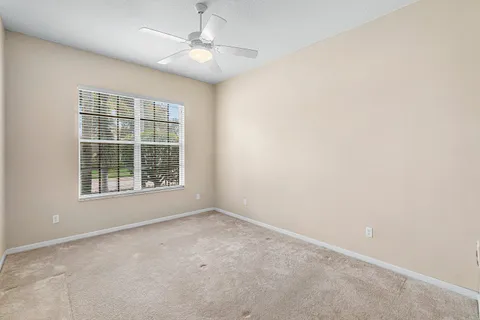 a open kitchen with stainless steel appliances granite countertop a refrigerator and a stove