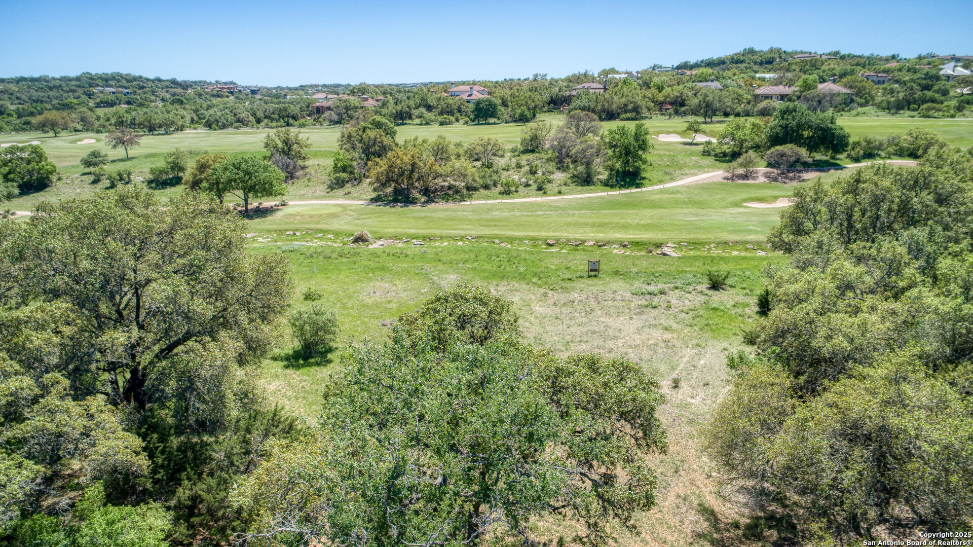 Lot 15 Muirfield Boerne, TX 78006 - Photo 5 of 18 a view of a lush green forest with trees and some houses