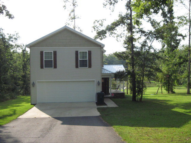 117 Jenkins Road Forsyth, GA 31029 - Photo 5 of 18 a front view of a house with a yard