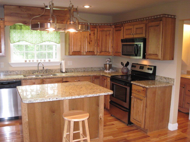 117 Jenkins Road Forsyth, GA 31029 - Photo 7 of 18 a kitchen with stainless steel appliances granite countertop a sink stove and microwave