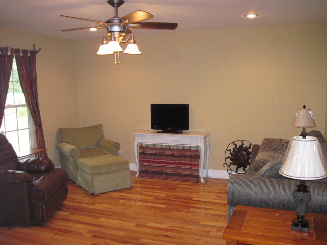 117 Jenkins Road Forsyth, GA 31029 - Photo 9 of 18 a living room with furniture and a flat screen tv