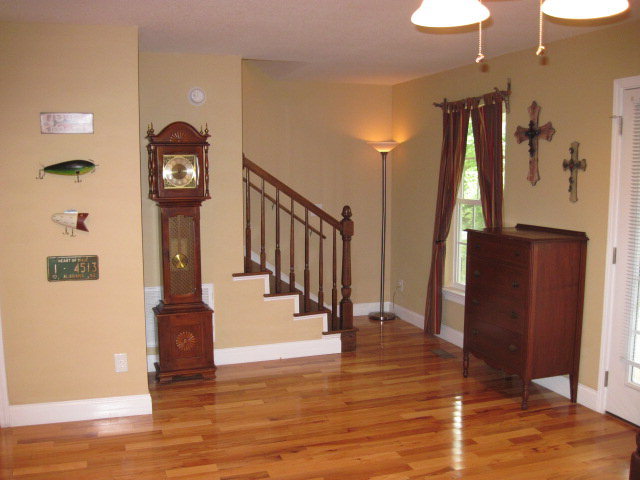 117 Jenkins Road Forsyth, GA 31029 - Photo 10 of 18 a view of a hallway with wooden floor and staircase