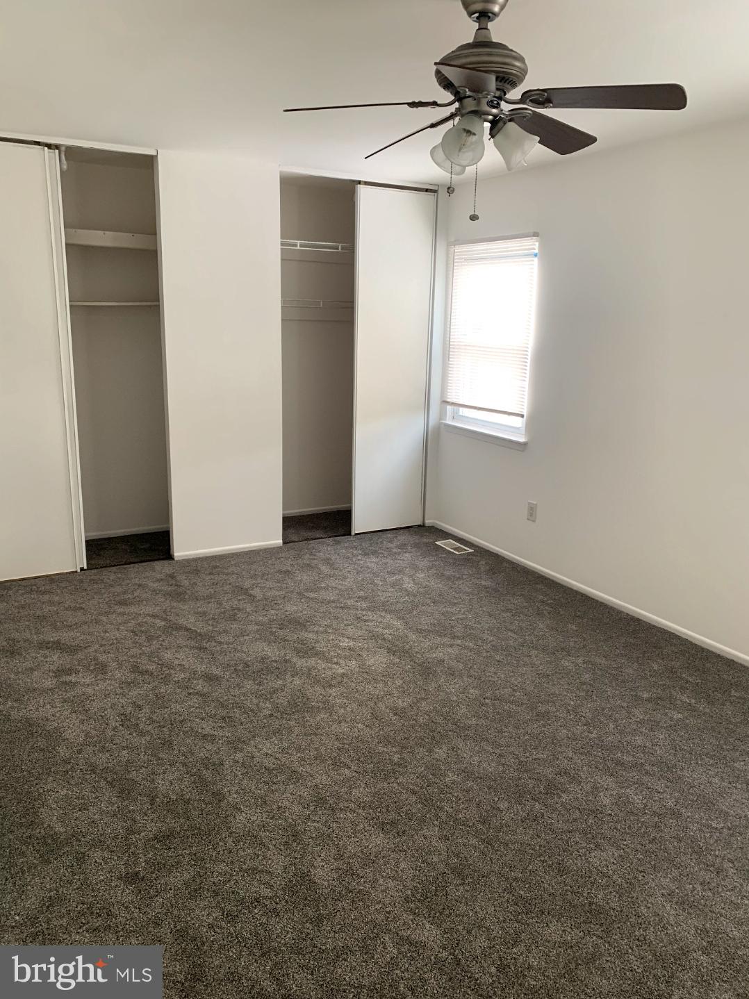 9358 Neil Road, Unit A Philadelphia, PA 19115 - Photo 11 of 24 an empty room with windows and fan
