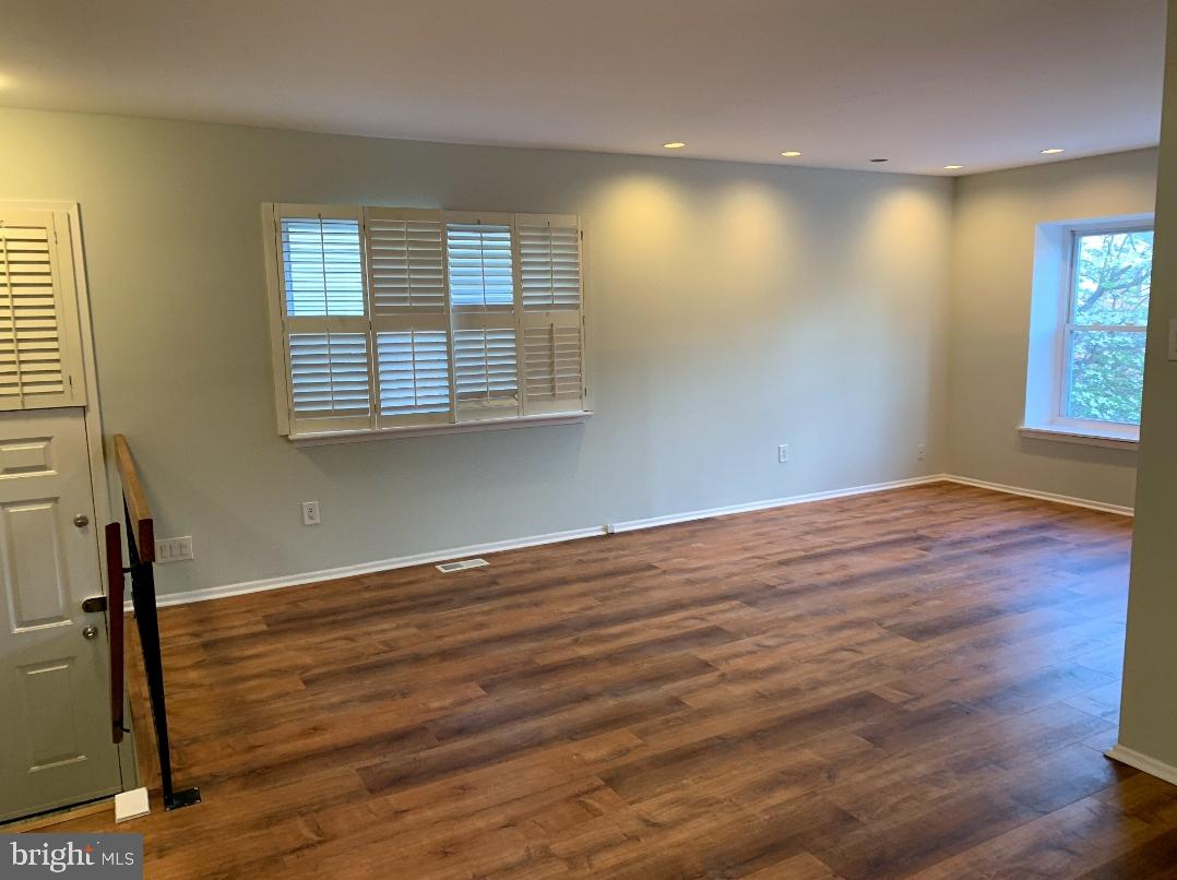 9358 Neil Road, Unit A Philadelphia, PA 19115 - Photo 3 of 24 a view of empty room with wooden floor and fan