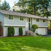 a front view of house with yard and outdoor seating