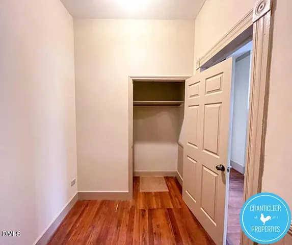 a view of a room with wooden floor and staircase