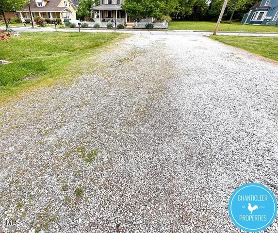 a view of a swimming pool and a yard