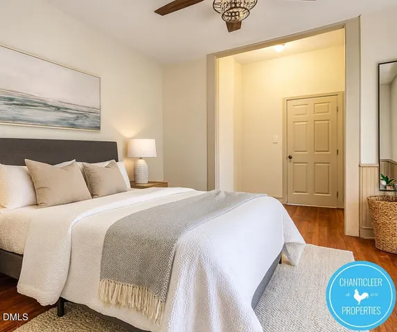 a bedroom with a bed and a table