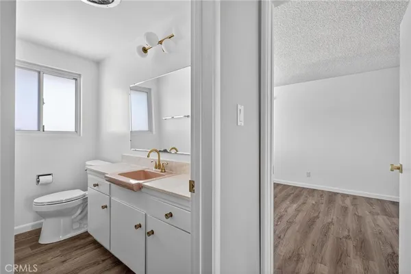 a bathroom with a toilet and a sink