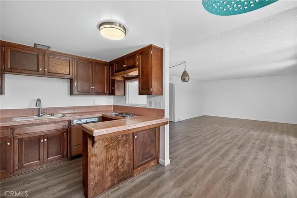 a kitchen with a stove and a sink