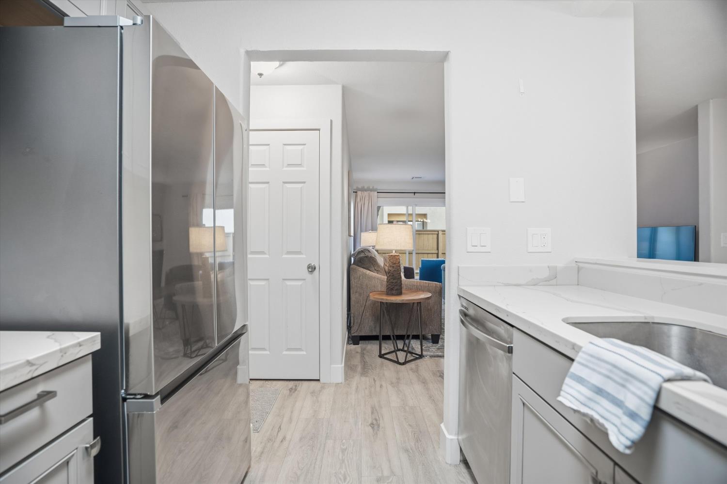 3424 Vintage Drive, Unit 152 Modesto, CA 95356 - Photo 11 of 24 a kitchen with a sink and a refrigerator