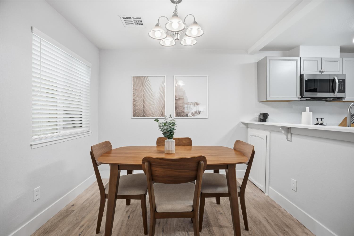 3424 Vintage Drive, Unit 152 Modesto, CA 95356 - Photo 4 of 24 a dining room with wooden floor and breakfast area