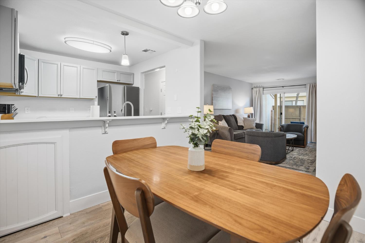 3424 Vintage Drive, Unit 152 Modesto, CA 95356 - Photo 5 of 24 a dining room with furniture and wooden floor