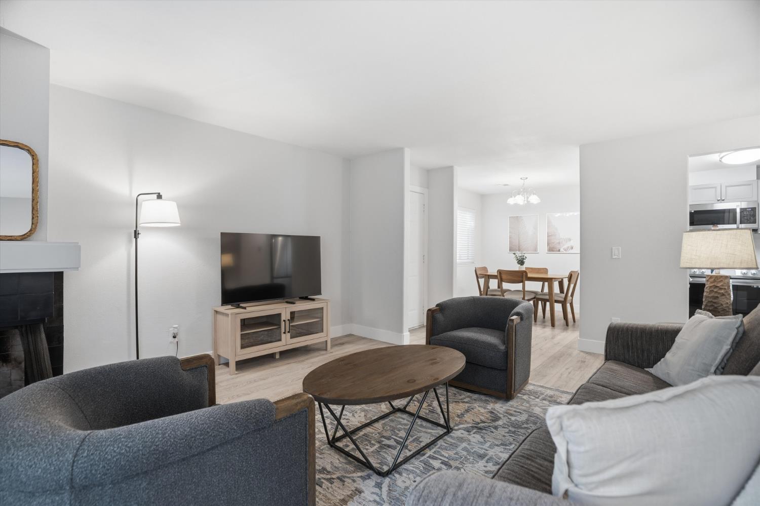 3424 Vintage Drive, Unit 152 Modesto, CA 95356 - Photo 6 of 24 a living room with furniture and a flat screen tv