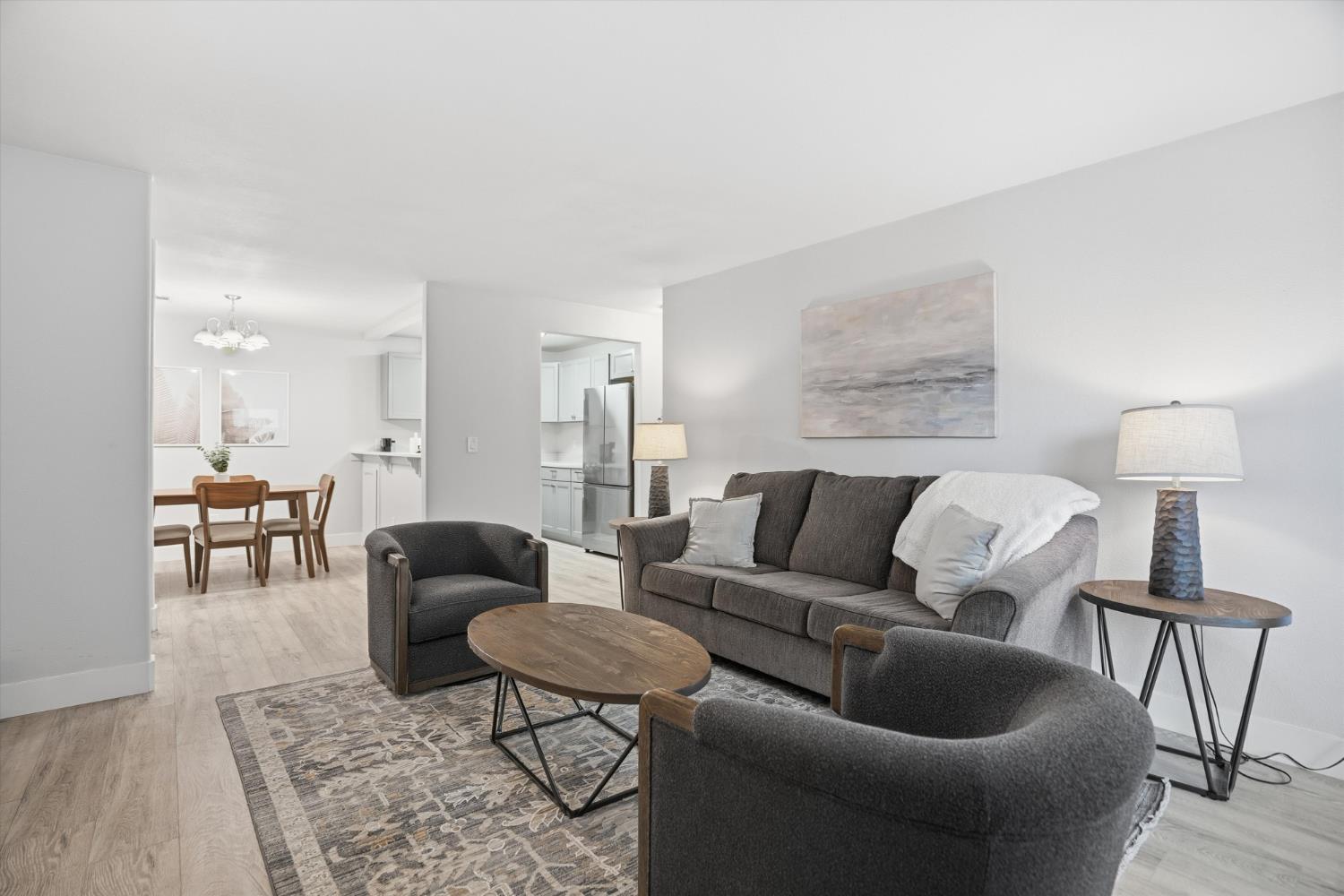 3424 Vintage Drive, Unit 152 Modesto, CA 95356 - Photo 7 of 24 a living room with furniture and a lamp