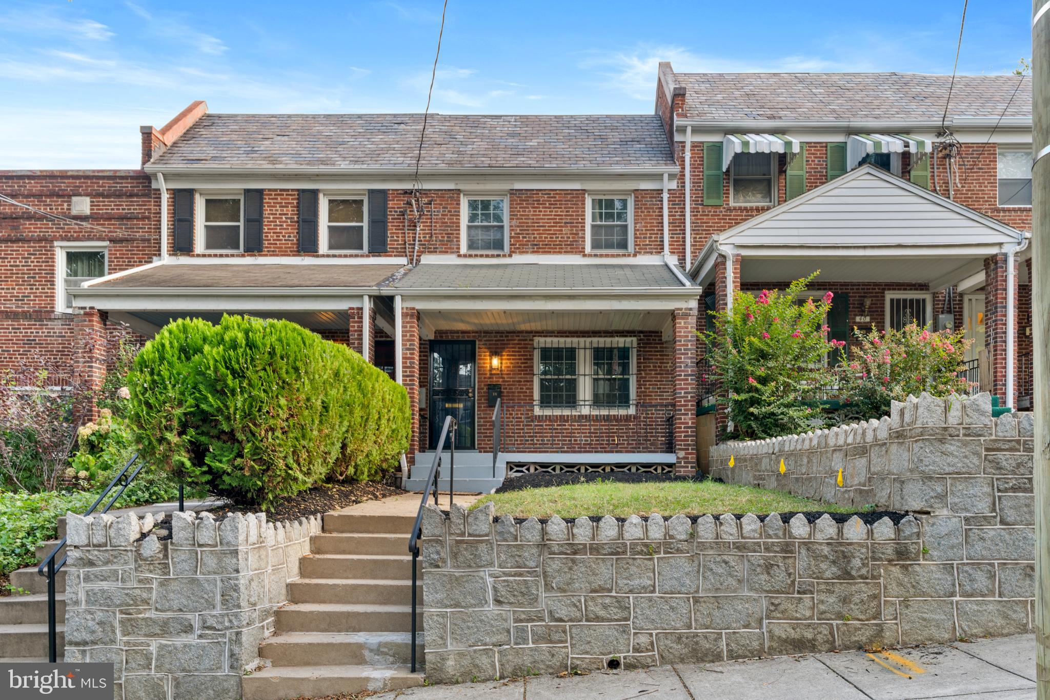 38 Crittenden Street Northeast Washington, DC 20011 - Photo 1 of 48 a front view of a house with a garden