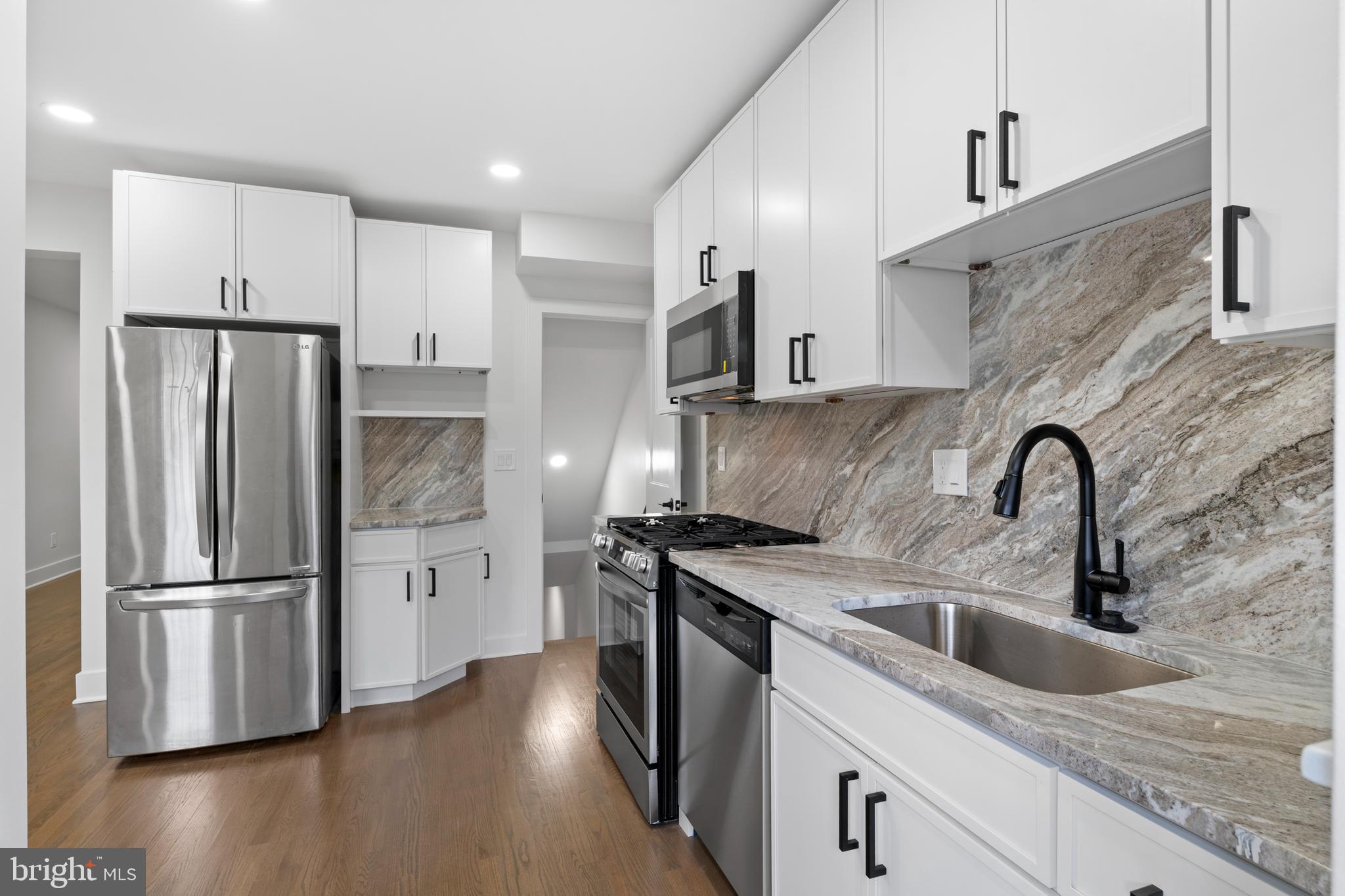 38 Crittenden Street Northeast Washington, DC 20011 - Photo 11 of 48 a kitchen with stainless steel appliances granite countertop a refrigerator a sink dishwasher a stove and a refrigerator