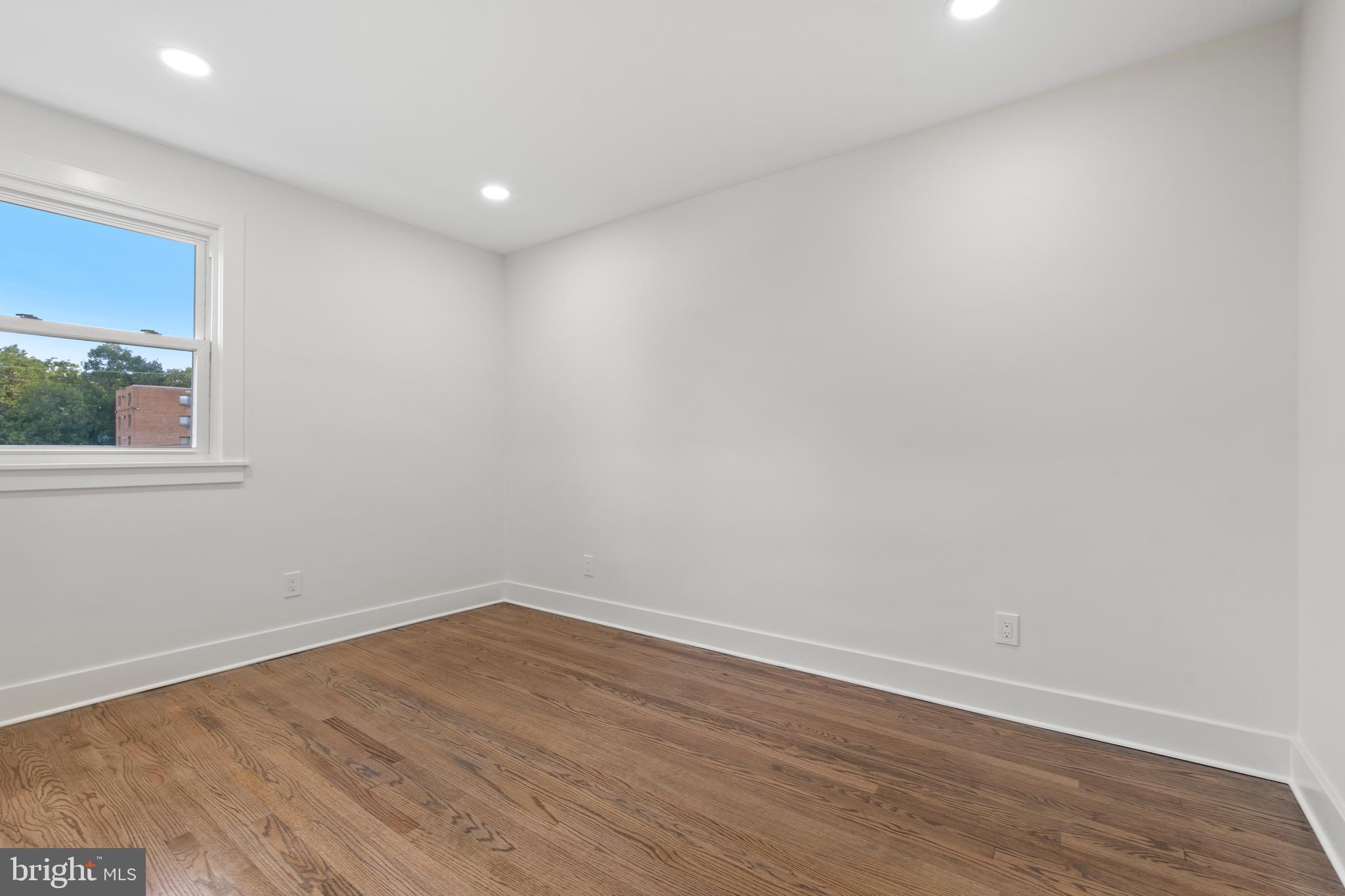 38 Crittenden Street Northeast Washington, DC 20011 - Photo 15 of 48 a view of empty room with wooden floor and fan