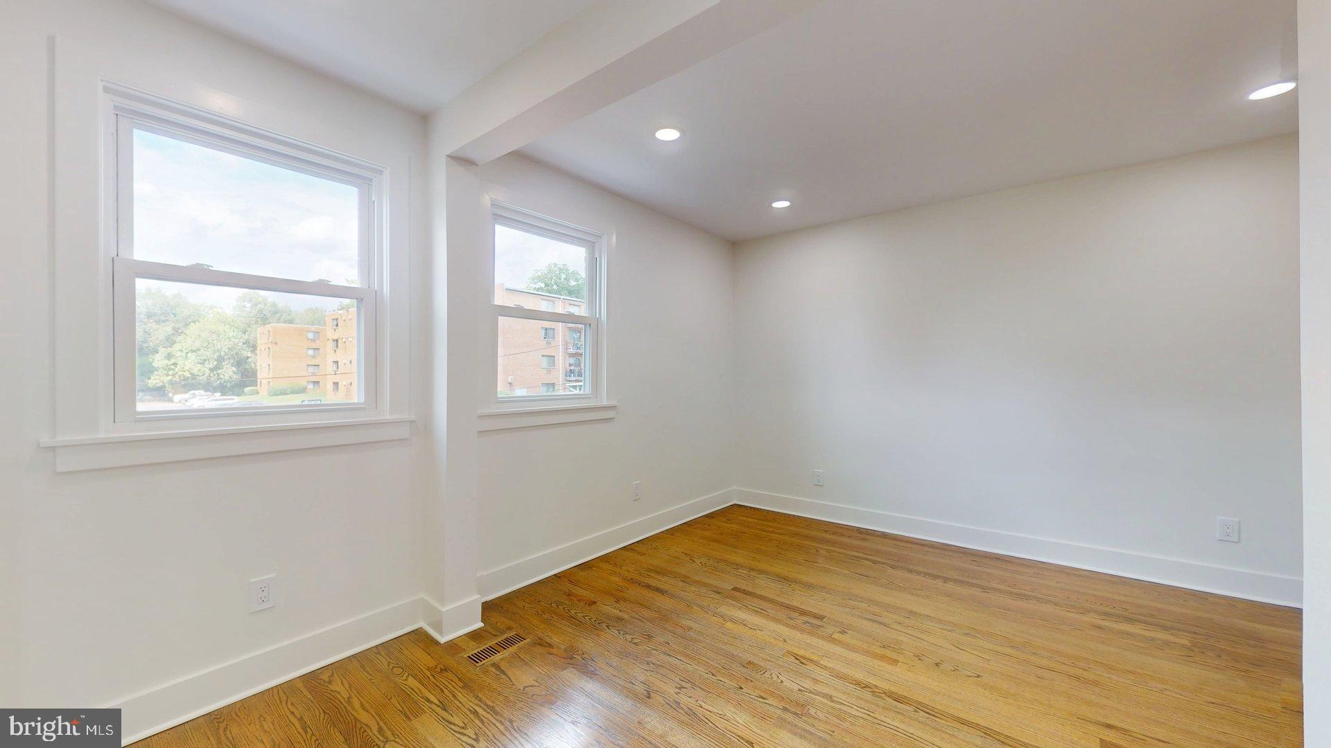 38 Crittenden Street Northeast Washington, DC 20011 - Photo 20 of 48 a view of empty room with wooden floor and fan