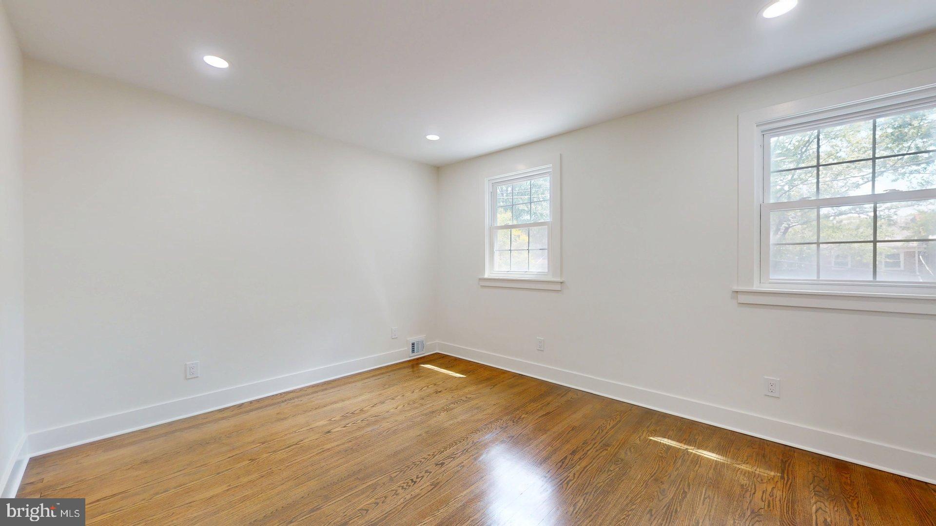 38 Crittenden Street Northeast Washington, DC 20011 - Photo 24 of 48 wooden floor in an empty room with a window