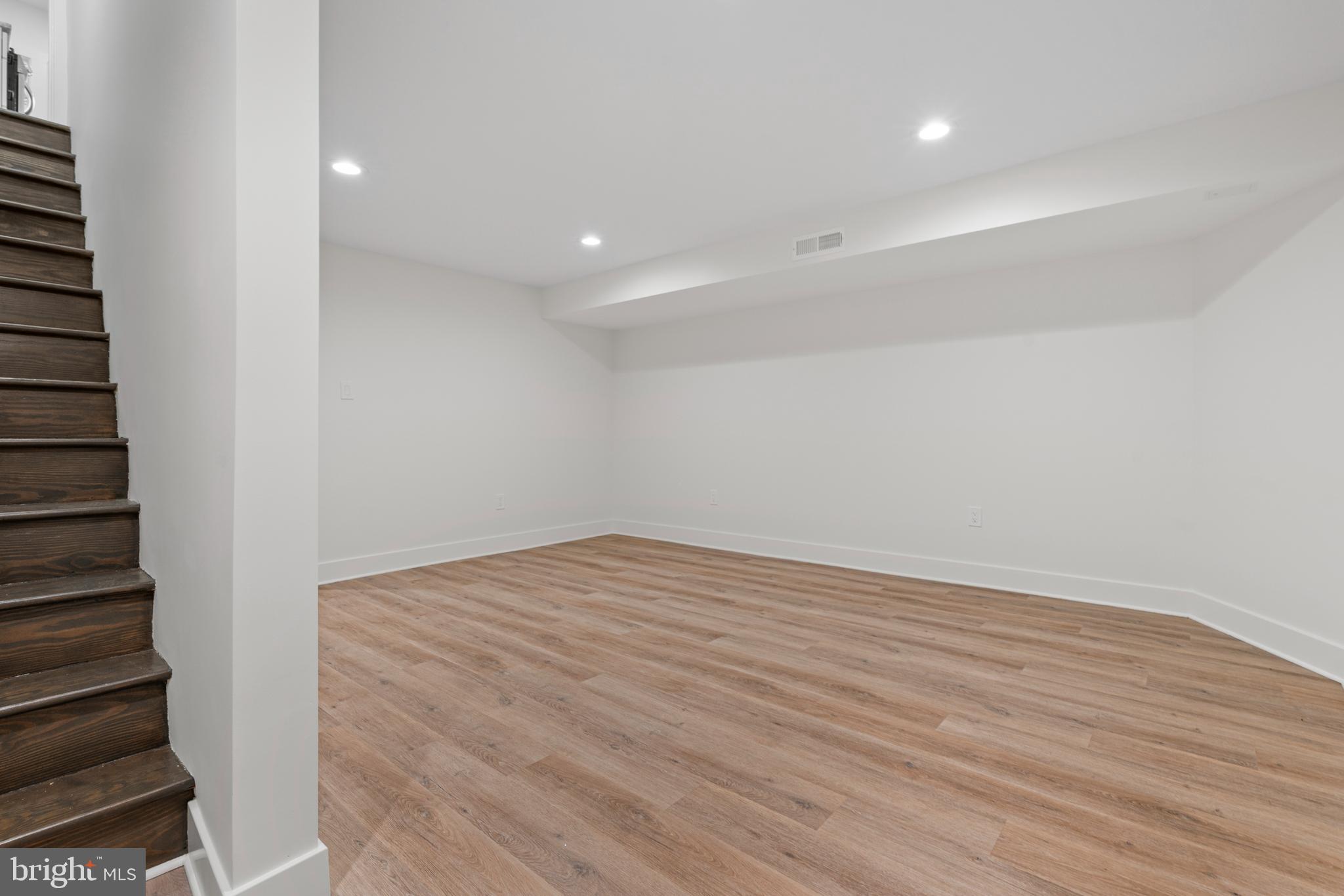 38 Crittenden Street Northeast Washington, DC 20011 - Photo 29 of 48 a view of an empty room with wooden floor