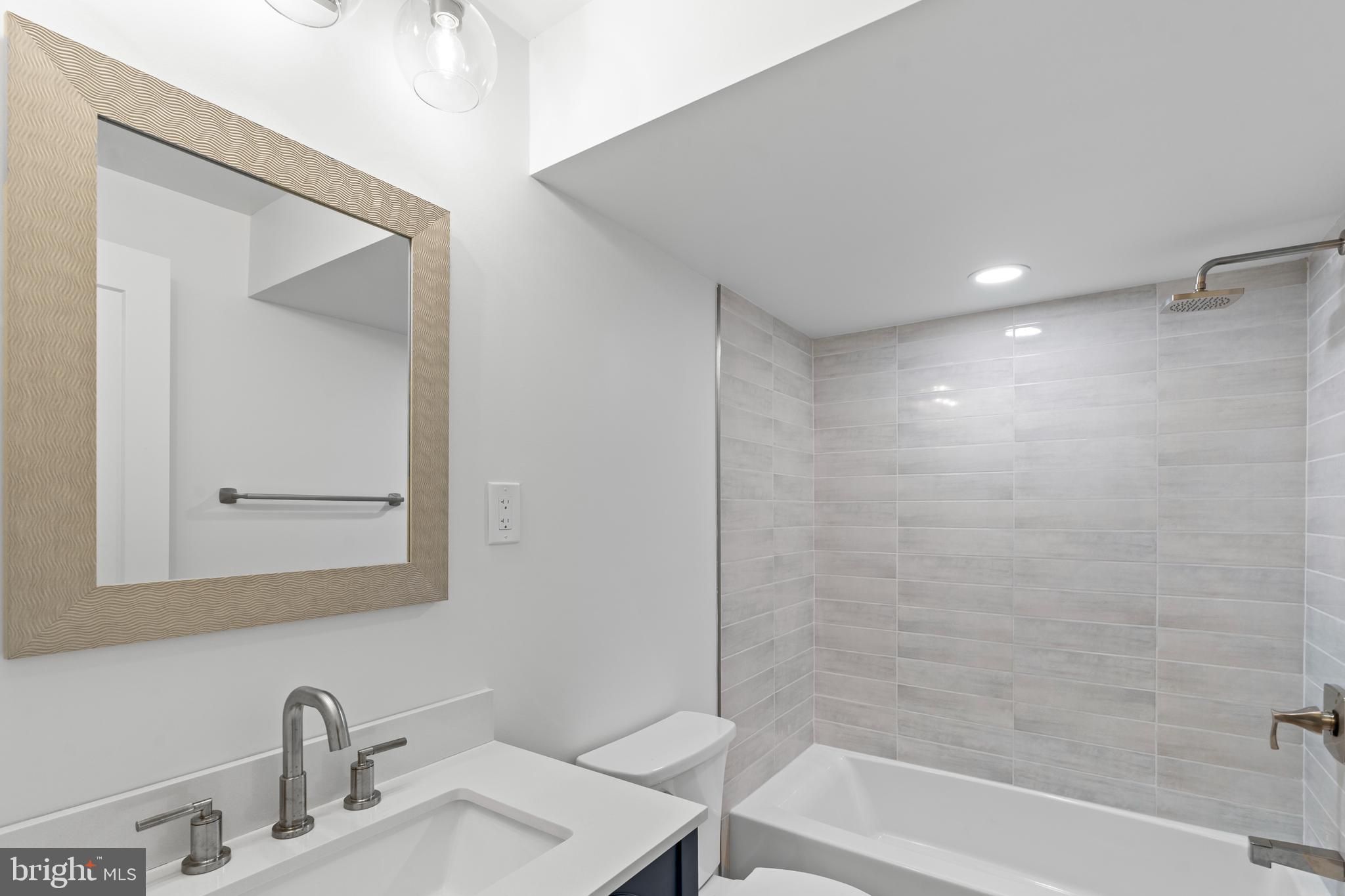 38 Crittenden Street Northeast Washington, DC 20011 - Photo 36 of 48 a bathroom with a sink and a bathtub