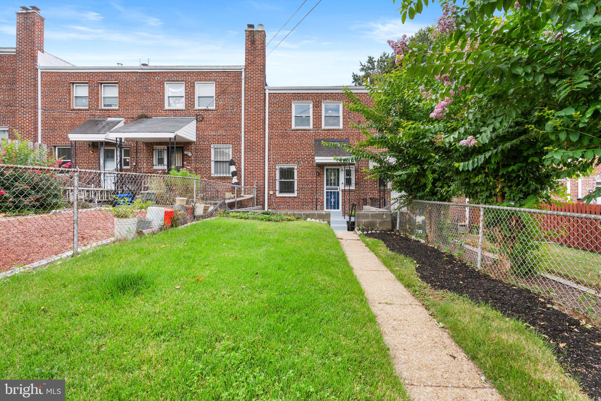 38 Crittenden Street Northeast Washington, DC 20011 - Photo 38 of 48 a front view of a house with a yard table and chairs