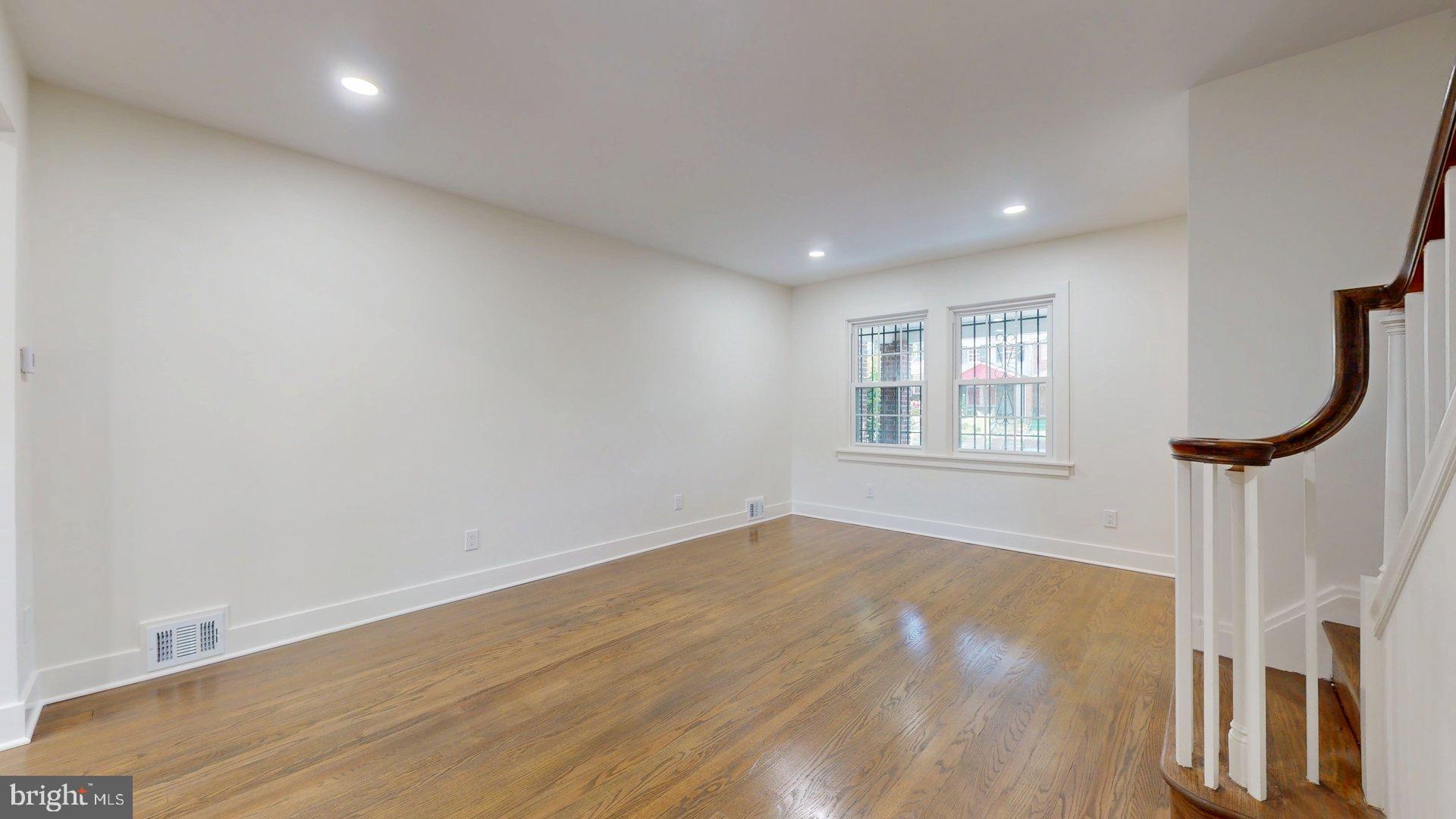 38 Crittenden Street Northeast Washington, DC 20011 - Photo 5 of 48 a view of a room with wooden floor and a window