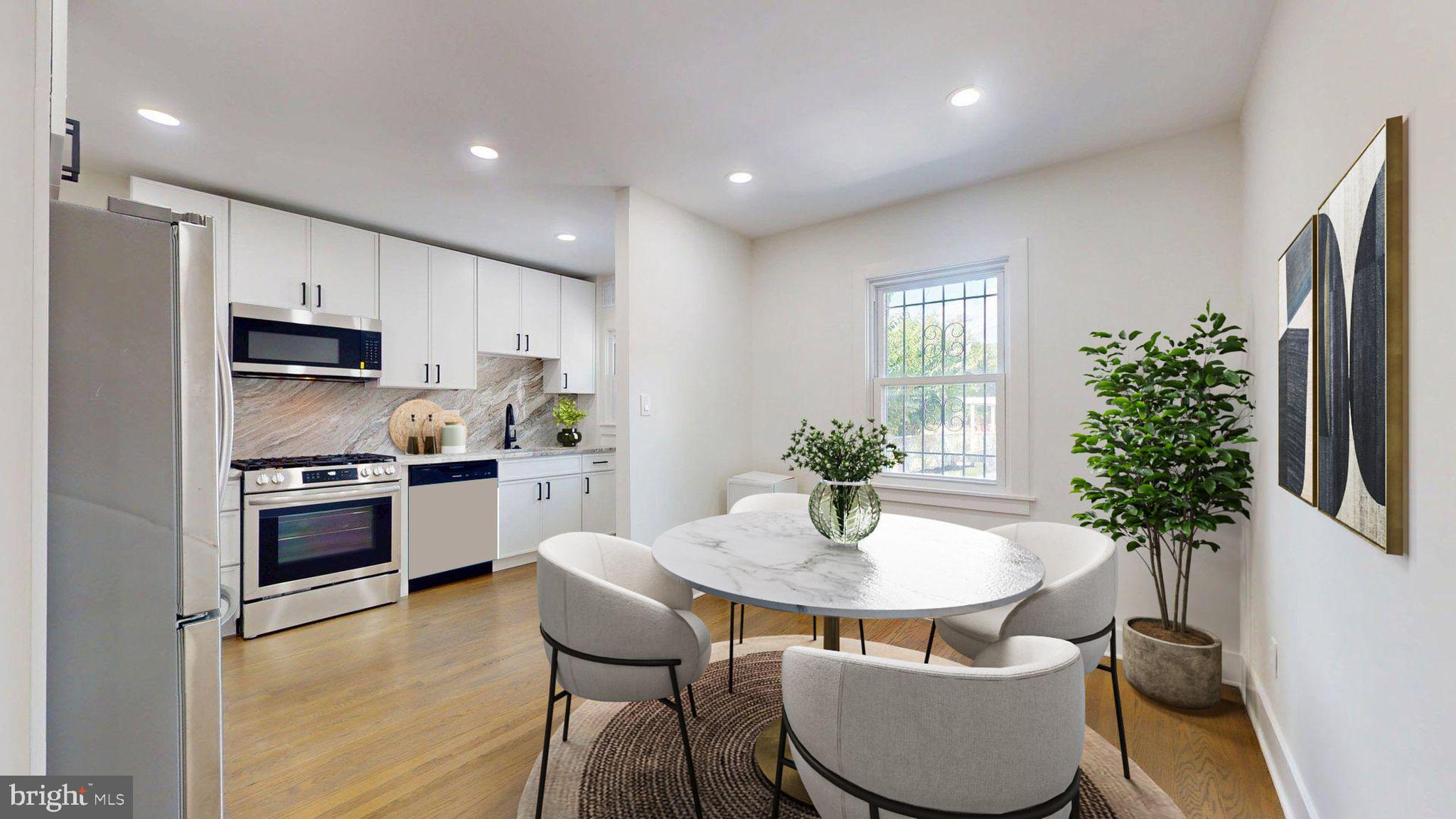 38 Crittenden Street Northeast Washington, DC 20011 - Photo 7 of 48 a kitchen with stainless steel appliances a dining table chair and stove