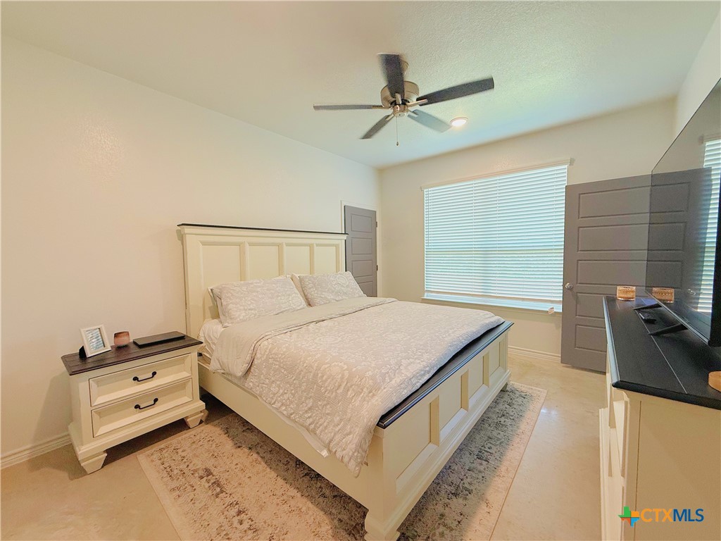 211 Riptide Road Temple, TX 76501 - Photo 3 of 11 a bedroom with a bed and a dresser