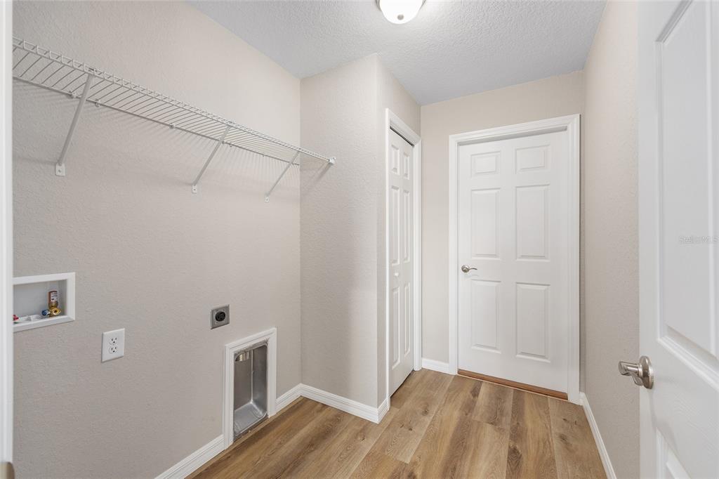 7822 North Manville Road Citrus Springs, FL 34434 - Photo 14 of 17 a view of a room with wooden floor