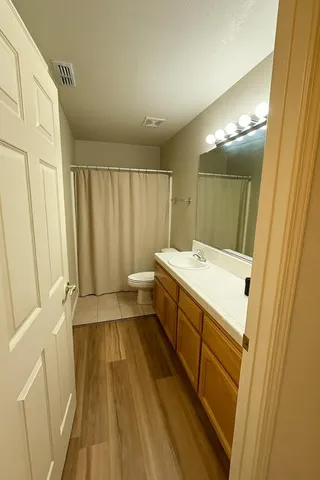 a bathroom with a sink a mirror and a bathtub
